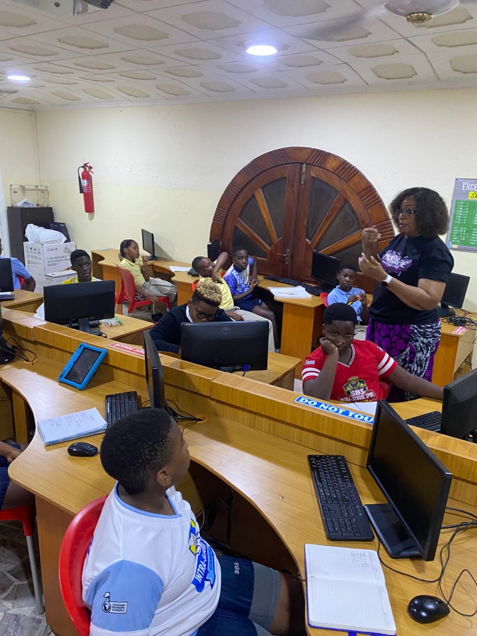 Computer lab session with young learners at workstations